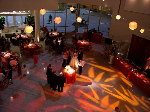 An evening reception inside the Rotunda with paper lanterns and patterned light